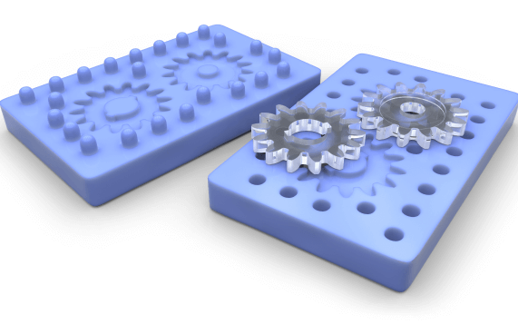Two Clear Plastic Gears on a Mold