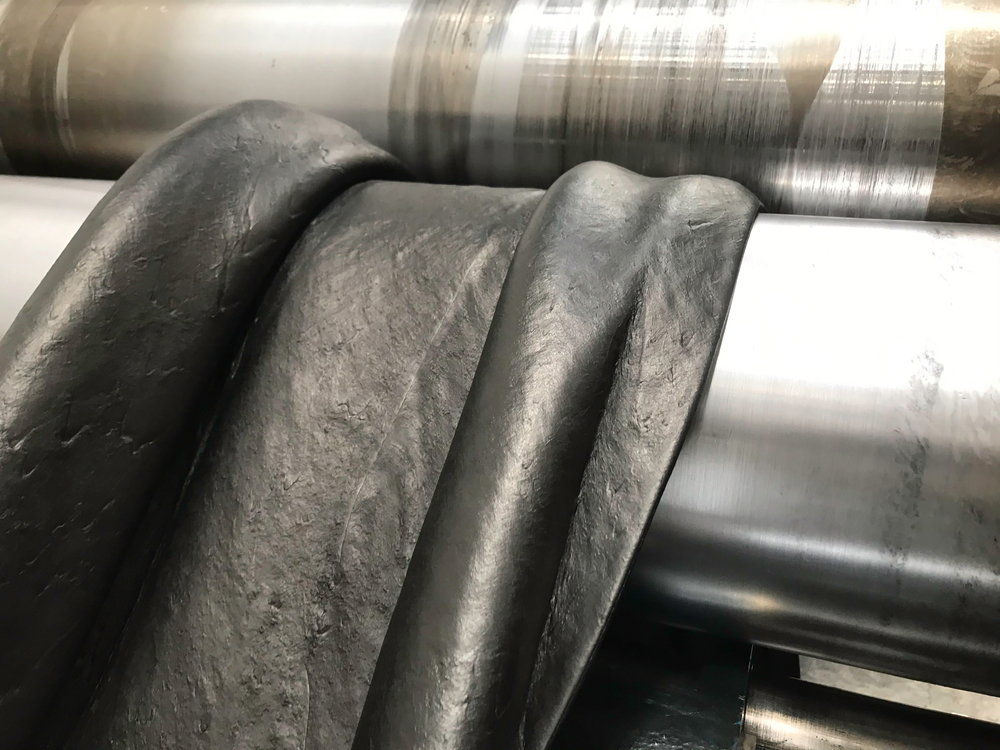 Sheet of rubber going into a piece of equipment